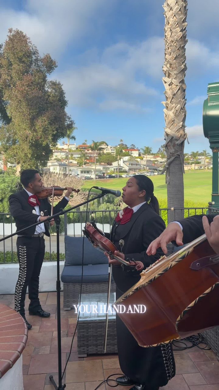 Violinist Nancy Gonzalez singing Risk It All at an outdoor wedding overlooking the coast
