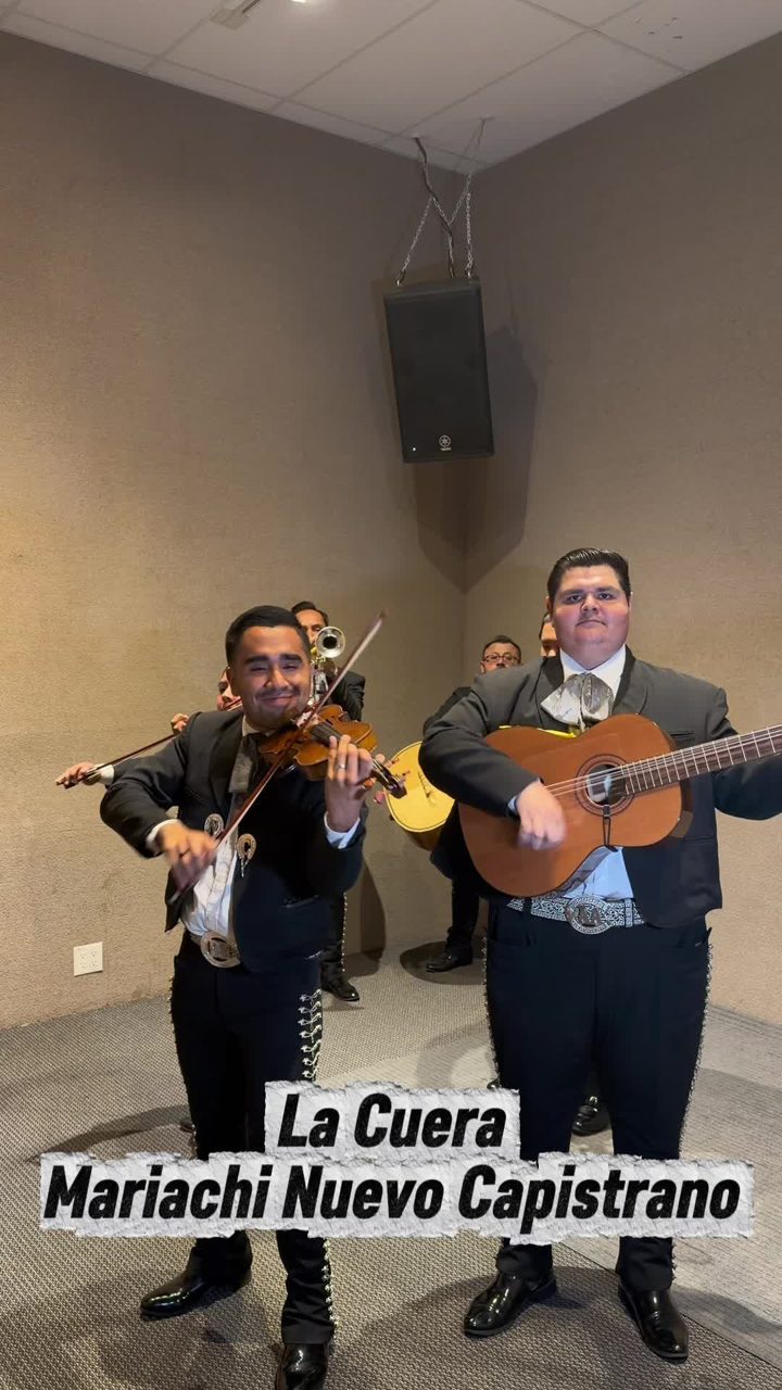 Violinist Daniel and guitarist Alejandro performing the traditional son La Cuera